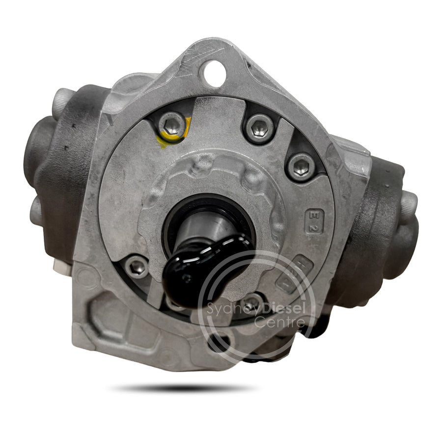 A diesel fuel pump shown from a front-facing angle, featuring a metallic silver cast body, black central spindle, and black side housings, on a white background with a watermark.